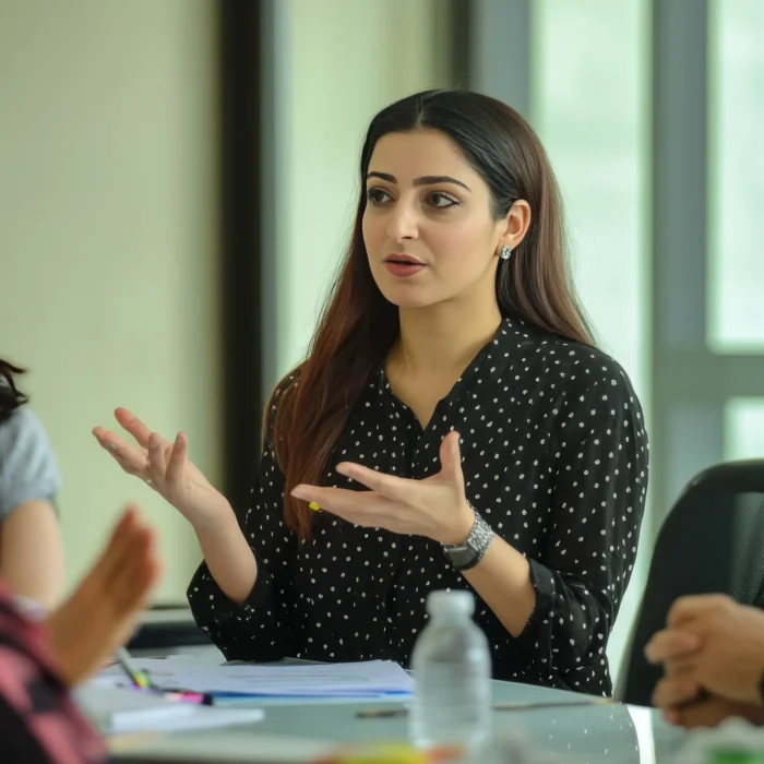 middle-eastern-woman-explains-new-strategy-her-colleagues-presentation-startup-office